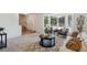 Bright living room with large windows, neutral decor, and an open floor plan at 5625 W 109Th Cir, Westminster, CO 80020