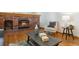 Cozy living room with a brick fireplace, hardwood floors, and comfortable seating at 5625 W 109Th Cir, Westminster, CO 80020