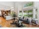 Bright living room featuring an open floor plan, large windows, and hardwood floors at 5625 W 109Th Cir, Westminster, CO 80020