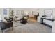 Comfortable living room with neutral colors, stylish furnishings, and a view into the dining room at 5625 W 109Th Cir, Westminster, CO 80020