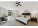 Spacious main bedroom featuring a seating area and large windows at 5625 W 109Th Cir, Westminster, CO 80020