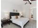 This main bedroom offers neutral tones, carpet floors, and is bright with natural light at 5625 W 109Th Cir, Westminster, CO 80020