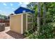 Backyard shed near an AC unit surrounded by mature trees and greenery at 5625 W 109Th Cir, Westminster, CO 80020