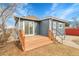 Backyard features a wood deck, siding and yard at 3368 W Gill Pl, Denver, CO 80219