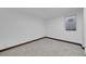 Finished basement room featuring a window and neutral carpet at 3368 W Gill Pl, Denver, CO 80219