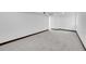Finished basement room showcasing neutral carpet and an open floor plan at 3368 W Gill Pl, Denver, CO 80219