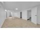 Spacious basement area with stairs, tile floor, and multiple doorways at 3368 W Gill Pl, Denver, CO 80219