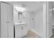 Bright basement bathroom with white vanity, mirror, and walk-in shower at 3368 W Gill Pl, Denver, CO 80219