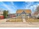 Attractive single-story home with a matching carport, accented by stone features and well-kept landscaping at 3368 W Gill Pl, Denver, CO 80219