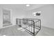 Hallway features a metal railing and updated flooring at 3368 W Gill Pl, Denver, CO 80219