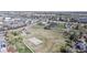 Aerial view showcases community park with playground, basketball court, and walking paths nearby at 11836 Columbine St, Thornton, CO 80233