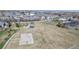 Wide shot of the community green space, with playground and basketball court at 11836 Columbine St, Thornton, CO 80233
