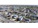 Expansive aerial view of a residential neighborhood featuring a mix of townhomes and single-Gathering houses with mature trees at 11836 Columbine St, Thornton, CO 80233
