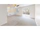 Large carpeted bedroom with neutral paint, a ceiling fan, a window, sliding glass doors, and a balcony at 11836 Columbine St, Thornton, CO 80233