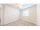 A bright bedroom has a window, electrical outlets, and neutral carpeting at 11836 Columbine St, Thornton, CO 80233