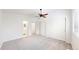 Neutral bedroom with ceiling fan, closet and access to a bathroom at 11836 Columbine St, Thornton, CO 80233