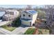 Stylish two-story home with solar panels, a two-car garage, a manicured lawn and mature trees in a quiet neighborhood at 11836 Columbine St, Thornton, CO 80233