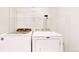 Laundry room with washer, dryer and overhead wire rack storage at 11836 Columbine St, Thornton, CO 80233