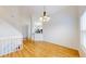 Bright living room with hardwood floors providing seamless access to the kitchen at 11836 Columbine St, Thornton, CO 80233