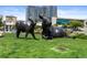Sculptural artwork of cows with an apartment building as a backdrop at 55 W 12Th Ave # 211, Denver, CO 80204