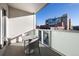 Cozy balcony with modern table and chairs, offering a pleasant outdoor seating area at 55 W 12Th Ave # 211, Denver, CO 80204