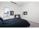 Bright bedroom featuring modern finishes, carpeted floors, and a wall-mounted TV for comfortable living at 55 W 12Th Ave # 211, Denver, CO 80204