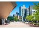 Views of the city skyline with a modern architecture building and street view at 55 W 12Th Ave # 211, Denver, CO 80204