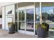 Museum Residences entrance featuring glass doors and planter decor at 55 W 12Th Ave # 211, Denver, CO 80204