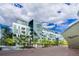 Contemporary building featuring large windows, balconies, and landscaping at 55 W 12Th Ave # 211, Denver, CO 80204