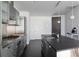 Modern kitchen featuring stainless steel appliances, sleek cabinetry, and a functional island with a sink at 55 W 12Th Ave # 211, Denver, CO 80204