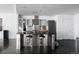 Modern kitchen with stainless steel appliances and center island at 55 W 12Th Ave # 211, Denver, CO 80204