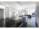 Open concept living with modern kitchen featuring stainless steel appliances at 55 W 12Th Ave # 211, Denver, CO 80204