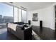 Modern living room with expansive windows offering bright views, stylish decor, and elegant design at 55 W 12Th Ave # 211, Denver, CO 80204