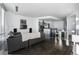 Bright living room featuring hardwood floors, modern furnishings, and large windows at 55 W 12Th Ave # 211, Denver, CO 80204