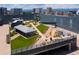 An outdoor rooftop terrace features drought resistant landscaping and an event space to enjoy the beautiful scenery at 55 W 12Th Ave # 211, Denver, CO 80204