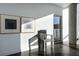 Bright sitting area with unique decor, dark floors, modern art, and natural light at 55 W 12Th Ave # 211, Denver, CO 80204