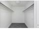 A walk-in closet with carpeted floors and minimalist design with ample room to hang your belongings at 55 W 12Th Ave # 211, Denver, CO 80204