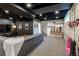 Finished basement featuring a large entertainment area, recessed lighting, and a sleek design at 4891 Depew St, Denver, CO 80212