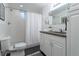 Clean bathroom with white subway tile, dark floors, and a modern vanity at 4891 Depew St, Denver, CO 80212