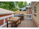 Back deck featuring wood decking, built-in seating and a barbecue grill at 4891 Depew St, Denver, CO 80212