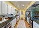 Well lit kitchen featuring stainless steel appliances and white subway tile at 4891 Depew St, Denver, CO 80212