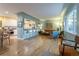 Open concept living room featuring hardwood floors and ample seating at 4891 Depew St, Denver, CO 80212