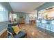 Cozy living room with hardwood floors featuring backyard views and an open concept at 4891 Depew St, Denver, CO 80212