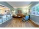 Comfortable living room with hardwood floors, natural light and views to kitchen at 4891 Depew St, Denver, CO 80212