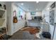 Bright office with a cowhide rug, desk, and a guitar hanging on the wall at 4891 Depew St, Denver, CO 80212