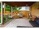 Charming outdoor living space featuring a bar, grill, and comfortable seating area at 4891 Depew St, Denver, CO 80212