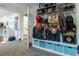 Neatly organized storage with blue bins, multiple bags, helmets and other gear at 4891 Depew St, Denver, CO 80212
