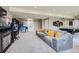 Finished basement includes an entertainment area, game room, and comfortable seating at 8133 Arapahoe Peak St, Littleton, CO 80125
