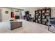 Entertaining basement with bar area, gaming area, and comfortable gray seating, perfect for leisure and entertainment at 8133 Arapahoe Peak St, Littleton, CO 80125