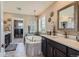 Luxurious bathroom features a soaking tub, marble countertops, and stylish fixtures at 8133 Arapahoe Peak St, Littleton, CO 80125